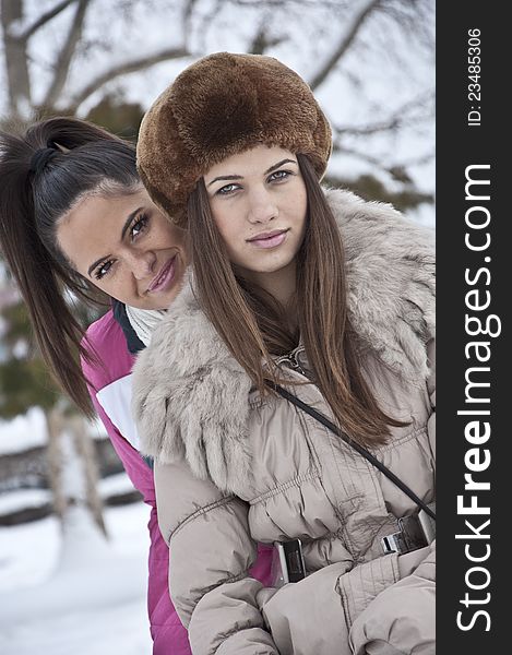 Beautiful young girls in winter clothes photographed outdoor. Beautiful young girls in winter clothes photographed outdoor