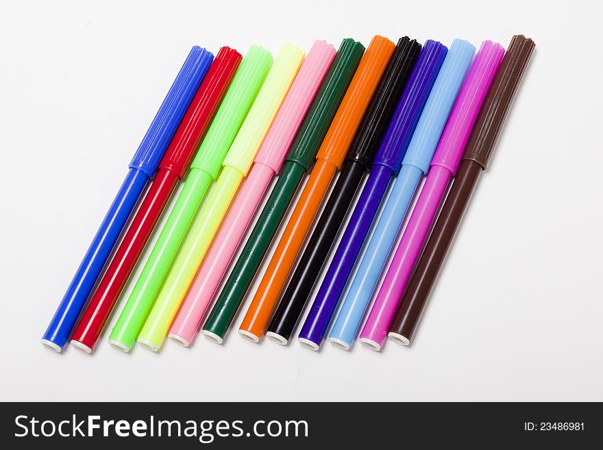 Group of bright color markers on white background. Group of bright color markers on white background