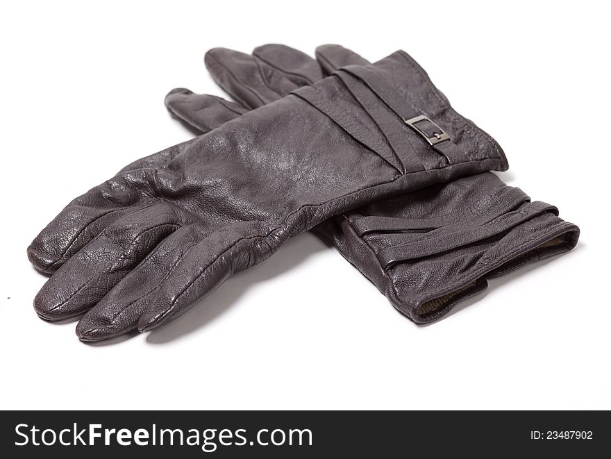 Ladies black leather gloves over white background