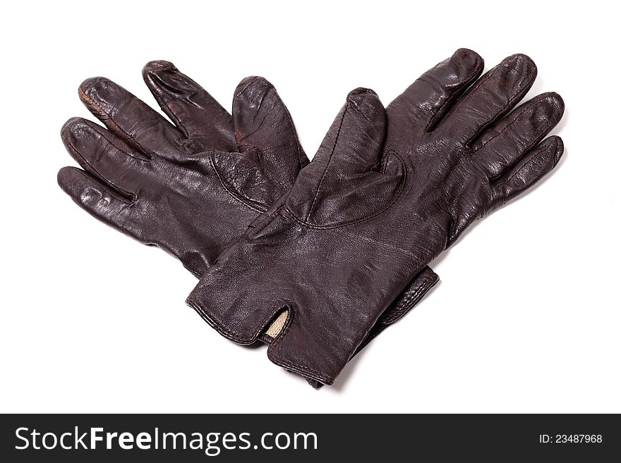 Ladies black leather gloves over white background