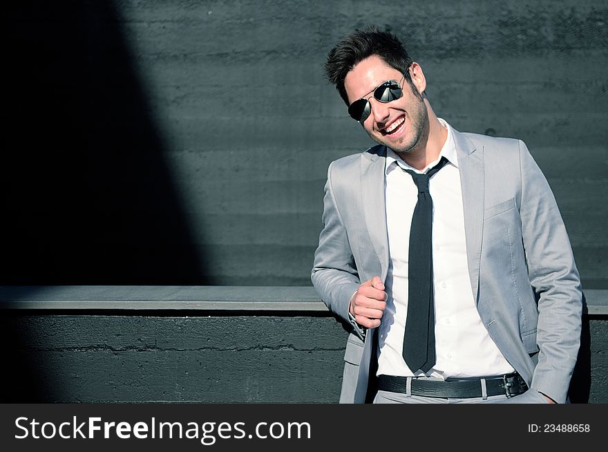 Portrait of a handsome young businessman laughing. Portrait of a handsome young businessman laughing