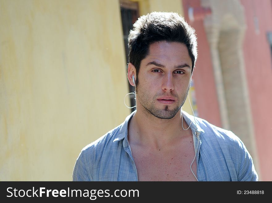 Young Attractive Man In Urban Background