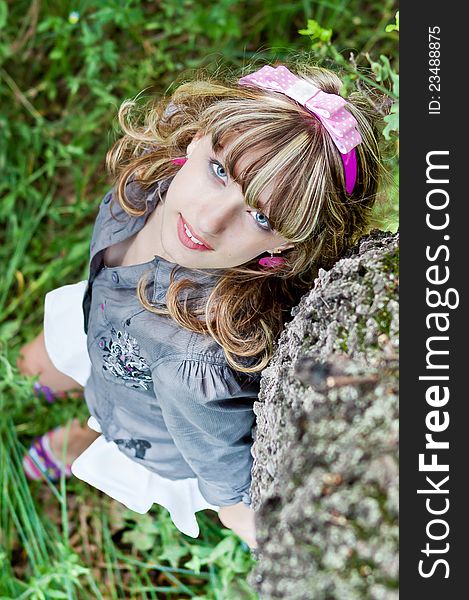 Portrait beautiful young girl near tree, look up. Portrait beautiful young girl near tree, look up