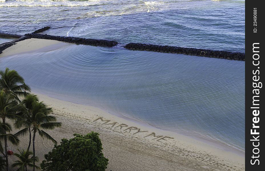 marry me written on the sand of waikiki beach, oahu, hawaii