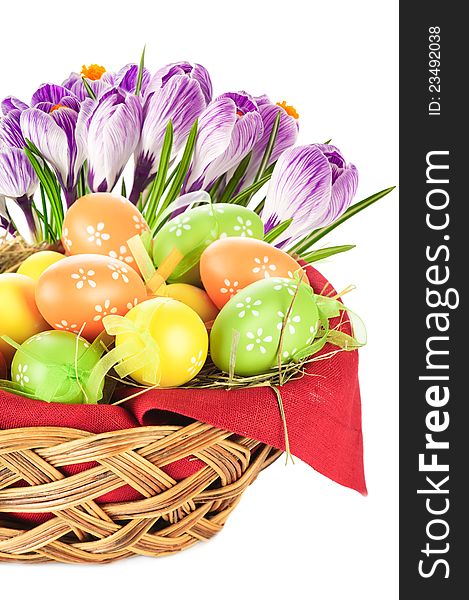 Painted easter eggs in basket and spring flowers. Painted easter eggs in basket and spring flowers