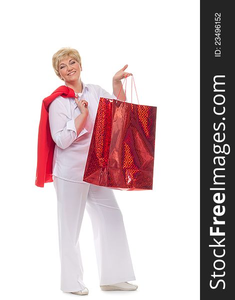 Portrait of a smiling adult woman with shopping bags  isolated against white background