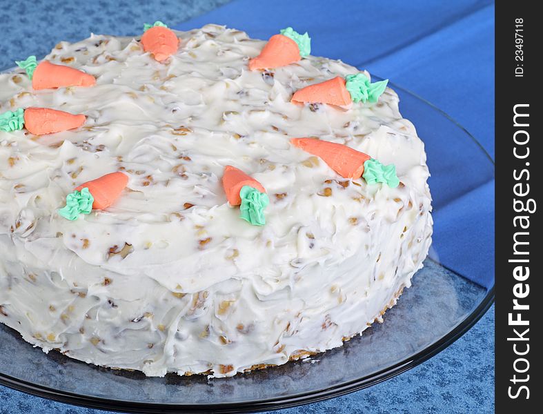 Whole carrot layer cake on a platter. Whole carrot layer cake on a platter