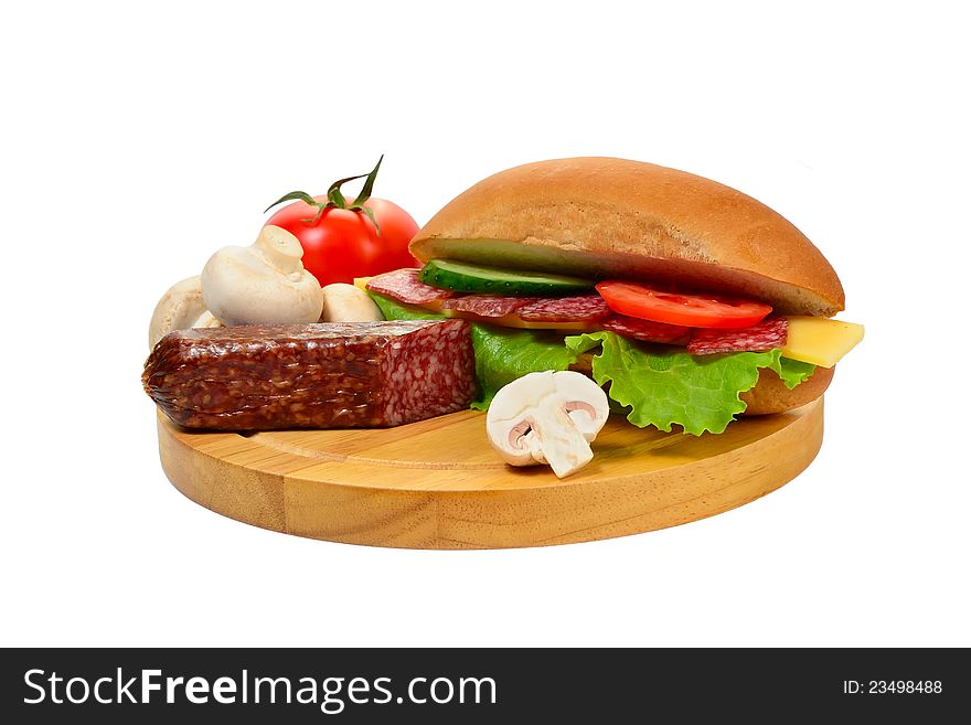 Sandwich with sausage and vegetables on cutting board isolated on white background. Sandwich with sausage and vegetables on cutting board isolated on white background