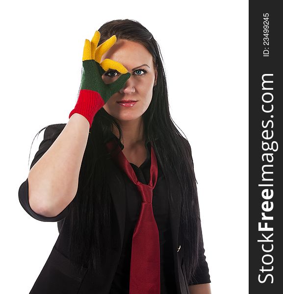 Pretty young woman with long hair wering Lithuanian flag glove looking through OK sign. isolated against white background. Pretty young woman with long hair wering Lithuanian flag glove looking through OK sign. isolated against white background