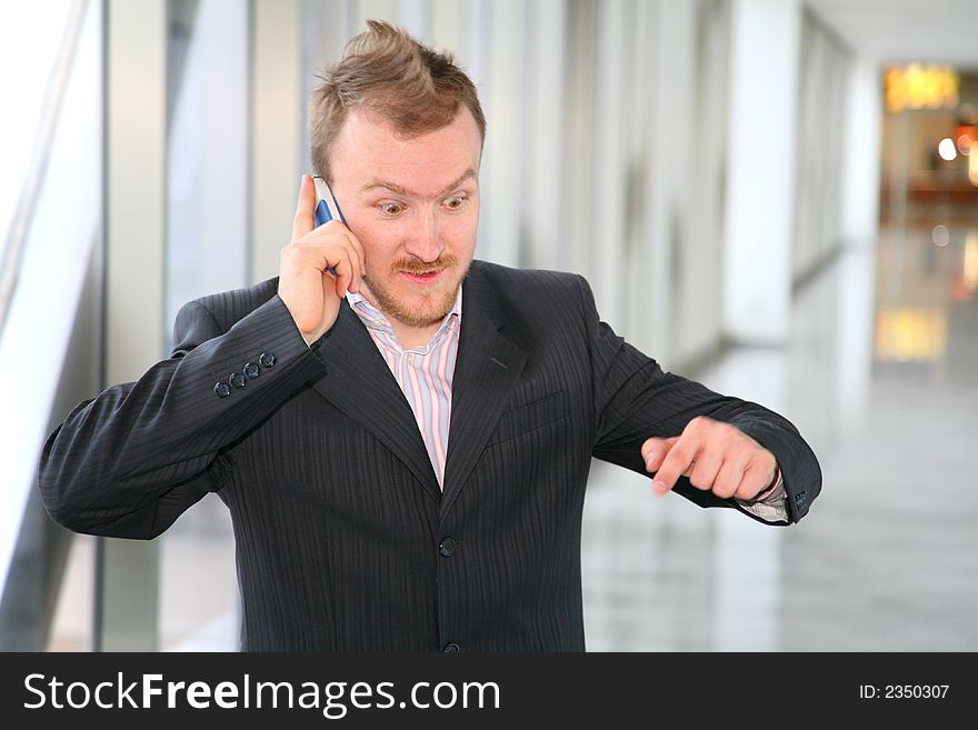 Businessman with phone in business of the center