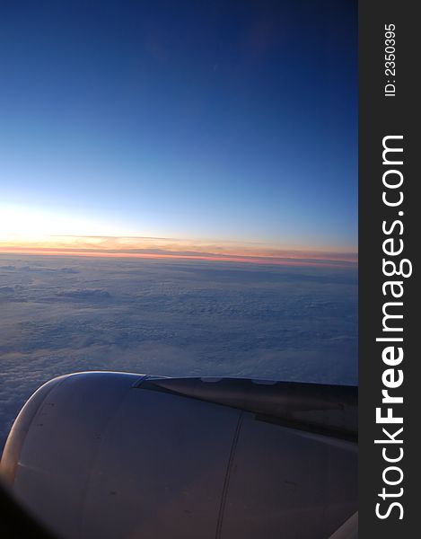 Top view from the wing of a airplane at sunrise. Top view from the wing of a airplane at sunrise