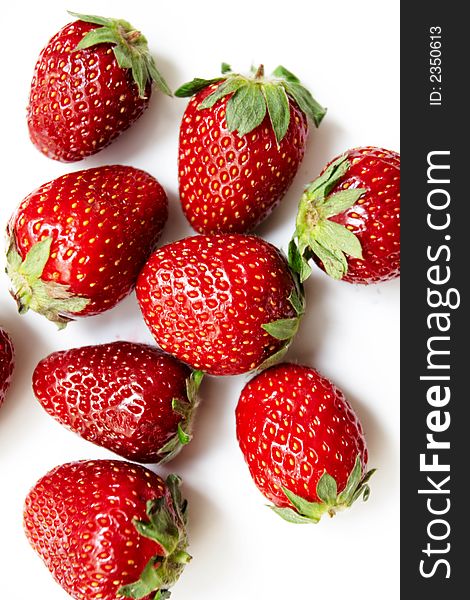 Eight ripe strawberries on a white background. Eight ripe strawberries on a white background