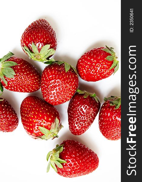 Nine ripe strawberries on a white background