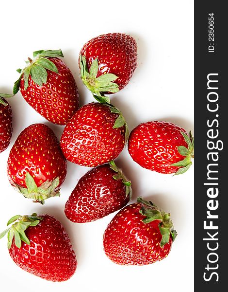 Red ripe strawberries on a white background