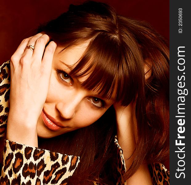 Close-up portrait of a beautiful woman in brown colours