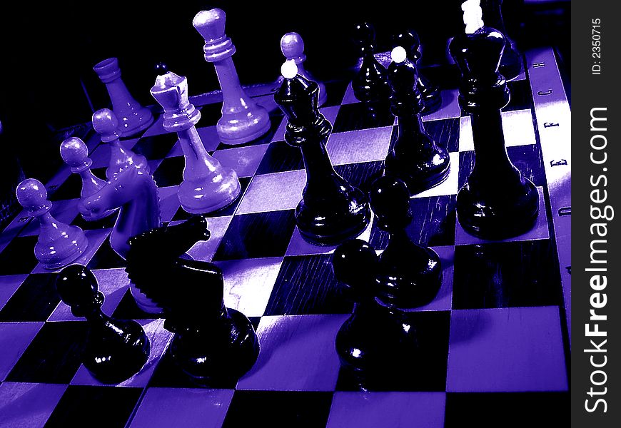 Chess of a figure on chess board. Dark blue colour