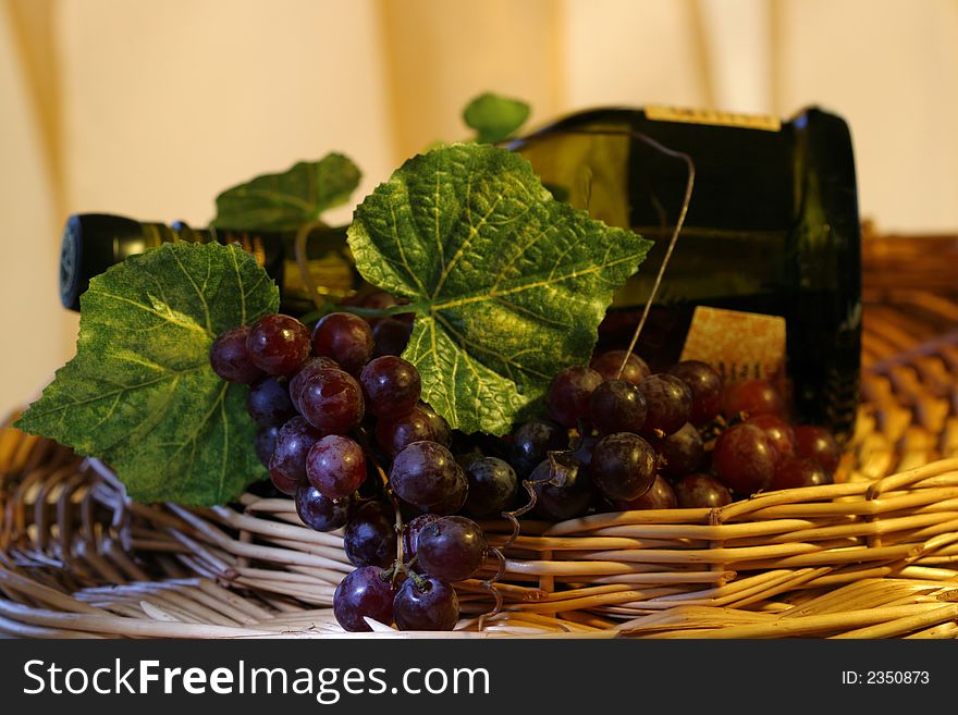 Grapevine, leaf and wine in a basket. Grapevine, leaf and wine in a basket