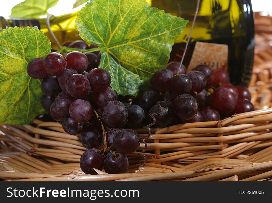 Grapes with leaf and wine