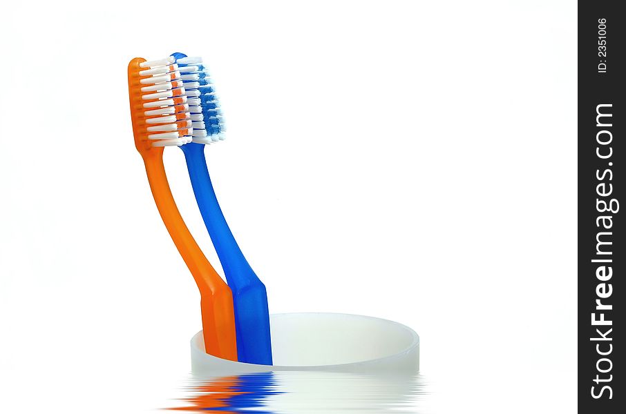 Tooth brushes on cup