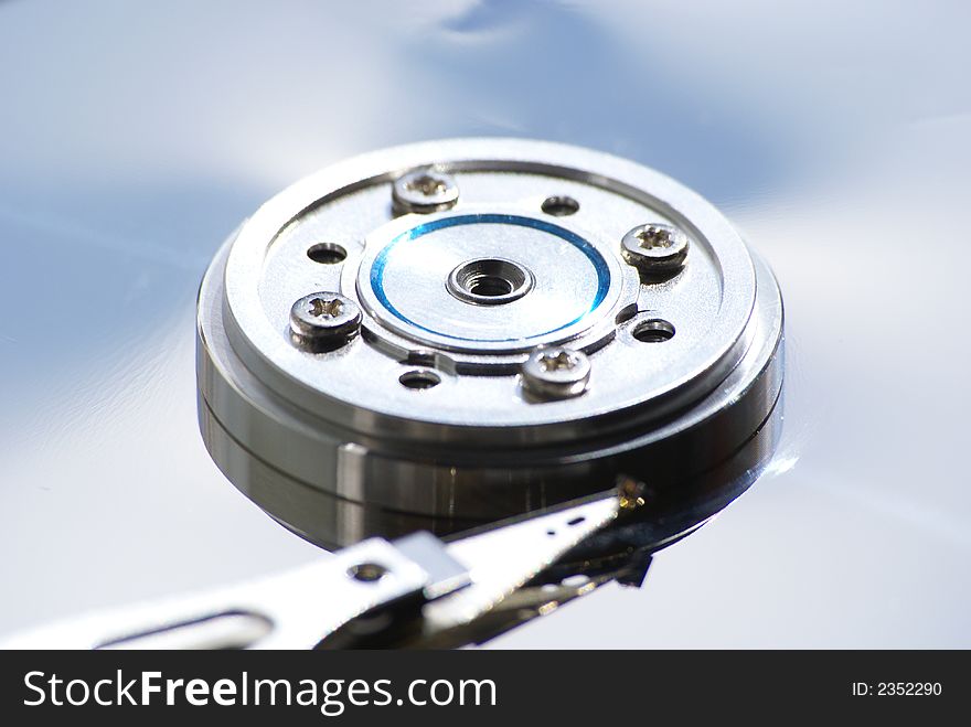 Opened hard drive on white background, closeup of head and disc. Opened hard drive on white background, closeup of head and disc