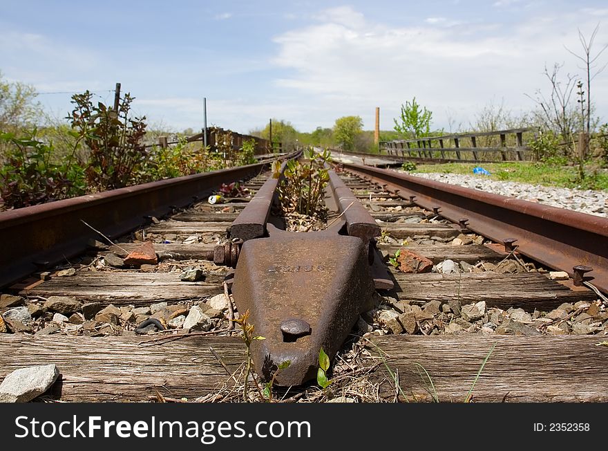 Old railroad no longer in use going off into the distance. Old railroad no longer in use going off into the distance