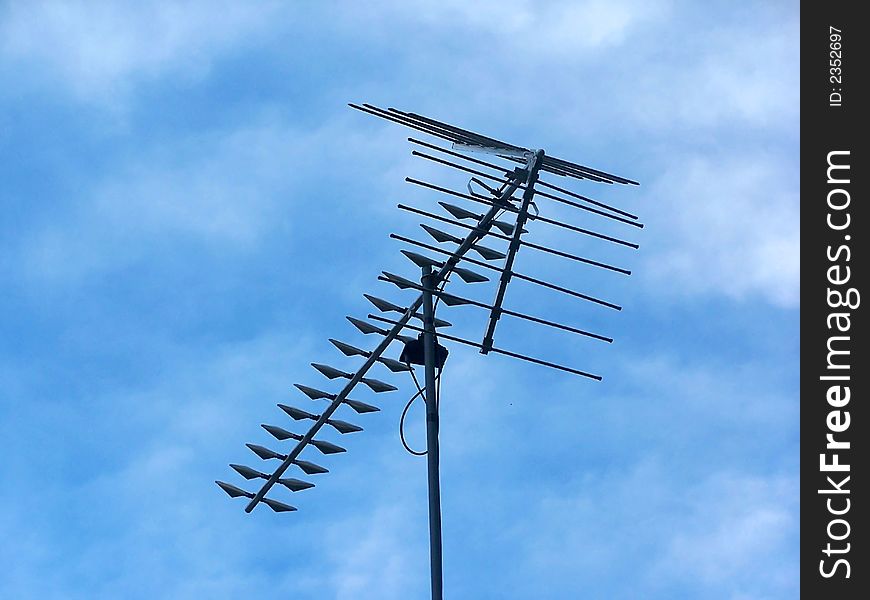 Arrow shaped aerial transmitter with pretty blue sky background. Arrow shaped aerial transmitter with pretty blue sky background.