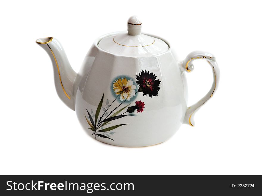 A teapot decorated with flowers. A teapot decorated with flowers.