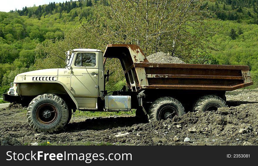 Old dump truck working on a construction site in Chilliwack, BC. Old dump truck working on a construction site in Chilliwack, BC