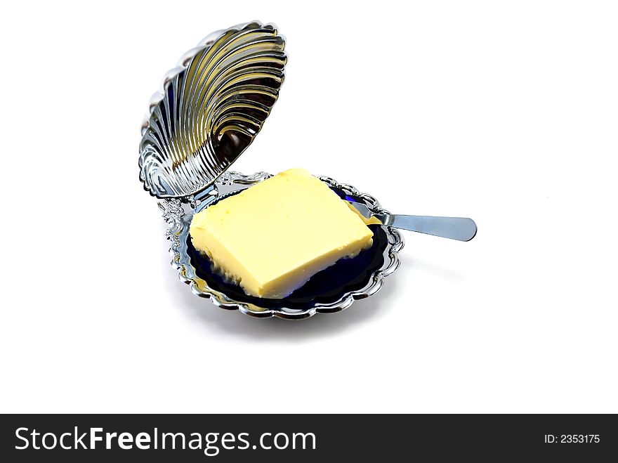 Beautiful butterdish with oil on a white background