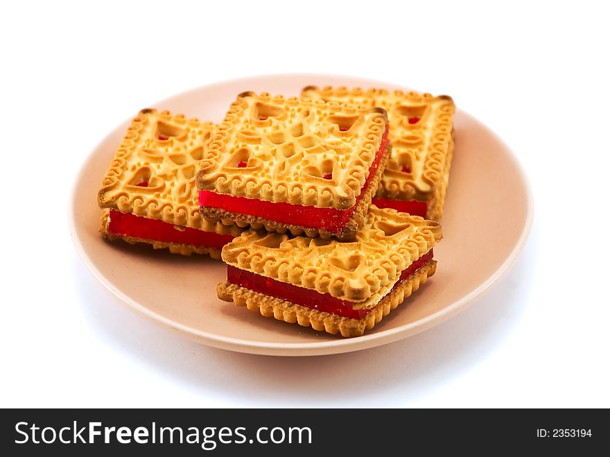 Beautiful cookies on a plate on a white background
