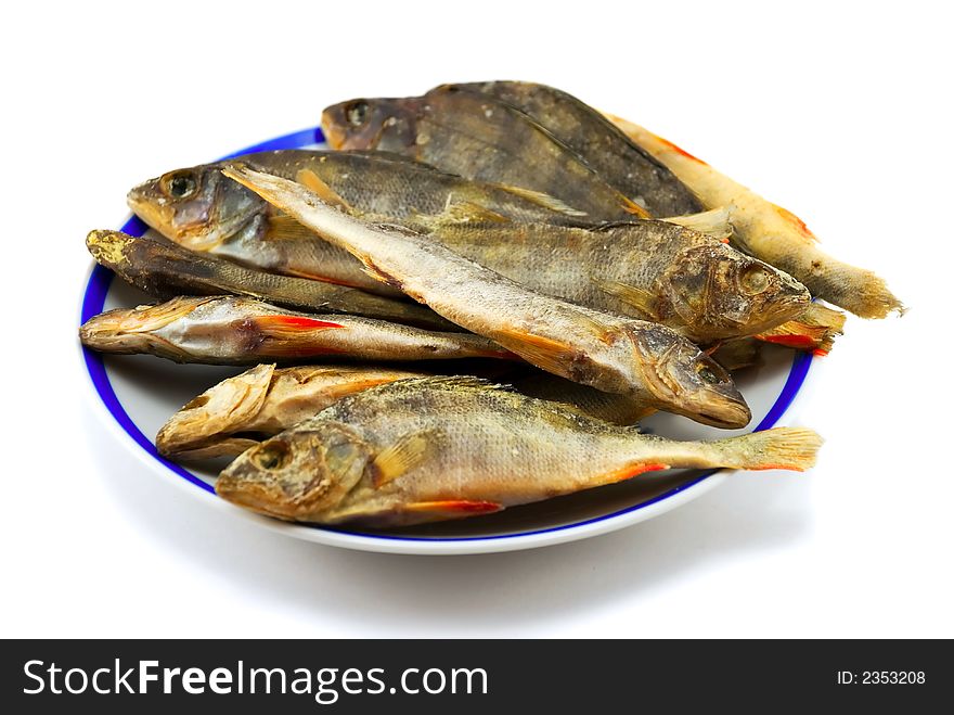 Beautiful the dried perch on a plate on a white background. Beautiful the dried perch on a plate on a white background