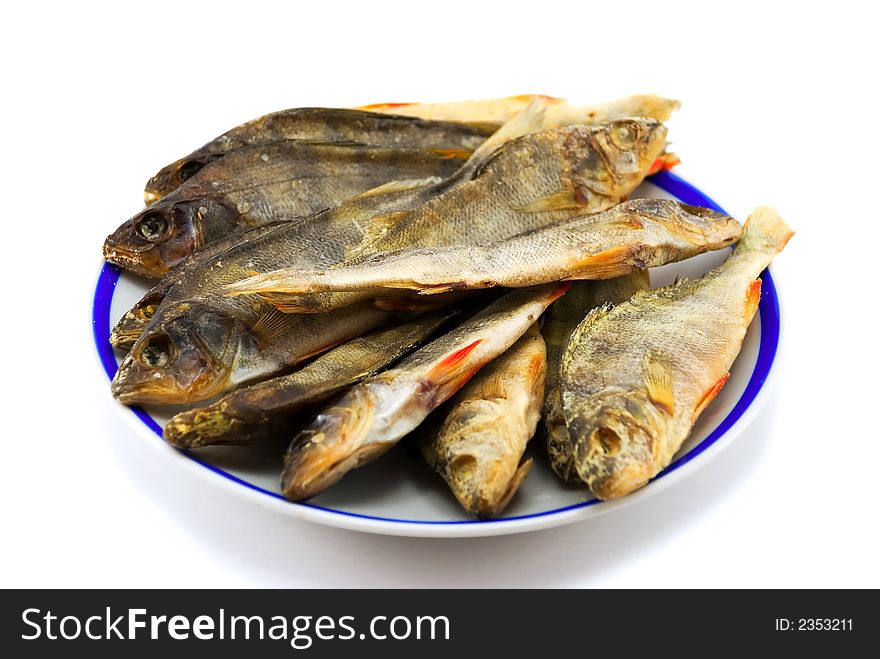 Beautiful the dried perch on a plate on a white background. Beautiful the dried perch on a plate on a white background