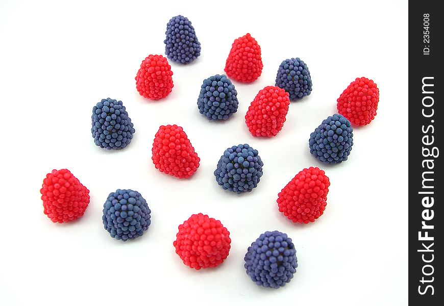 Beautiful fruit candy as berries on a white background