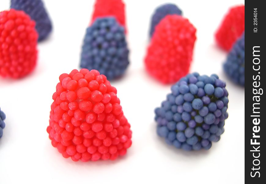 Beautiful fruit candy as berries on a white background