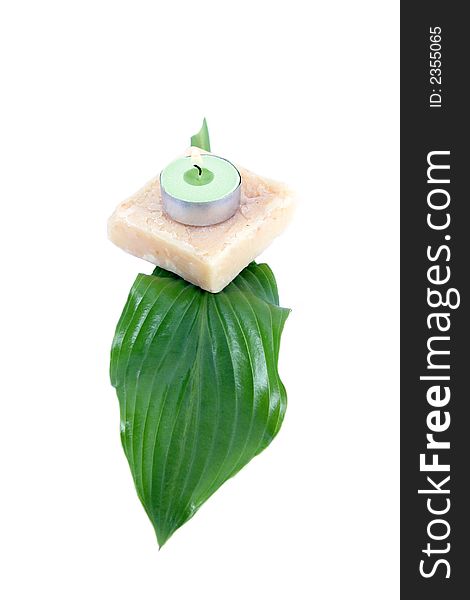 Green leaf, soap and candle - spa products isolated