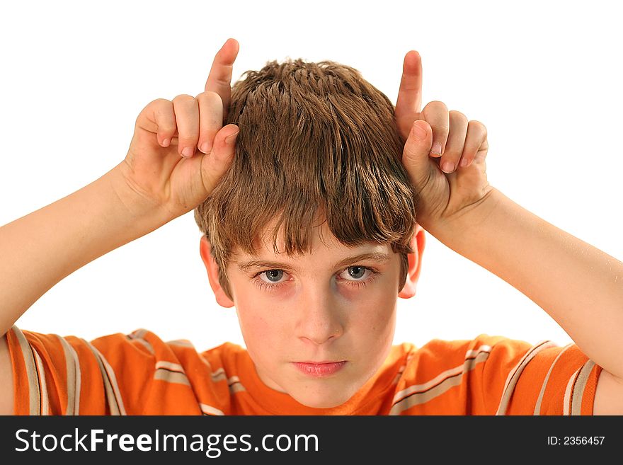 Photo of a young boy with horns isolated on white