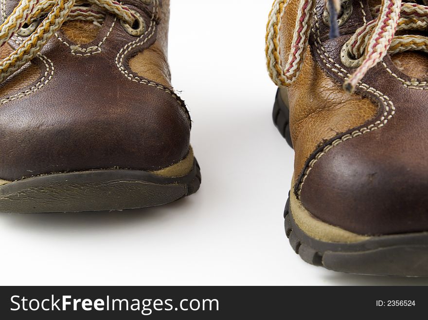 Child's boots close-up on white background