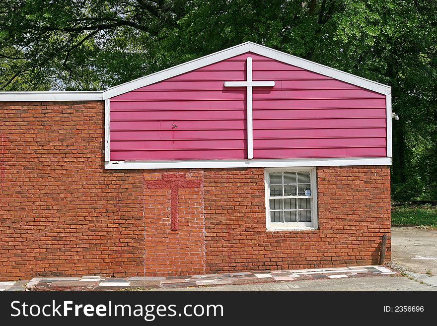 A small local church with purple painted siding. A small local church with purple painted siding