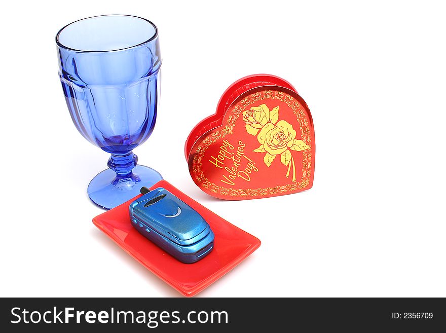 Isolated photo of a heart cellphone and glass level. Isolated photo of a heart cellphone and glass level