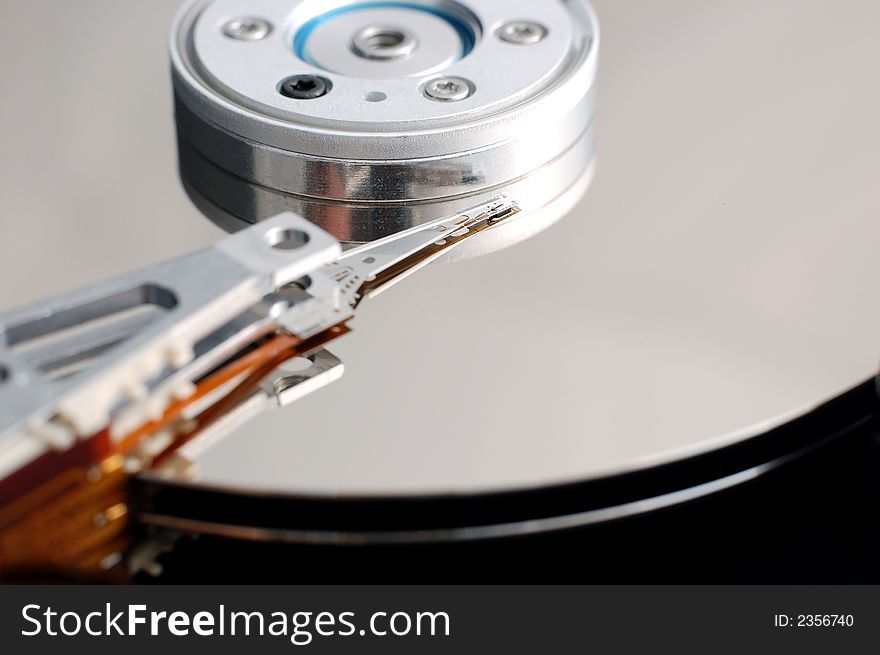 Close-up of an opened hard disk drive. Close-up of an opened hard disk drive