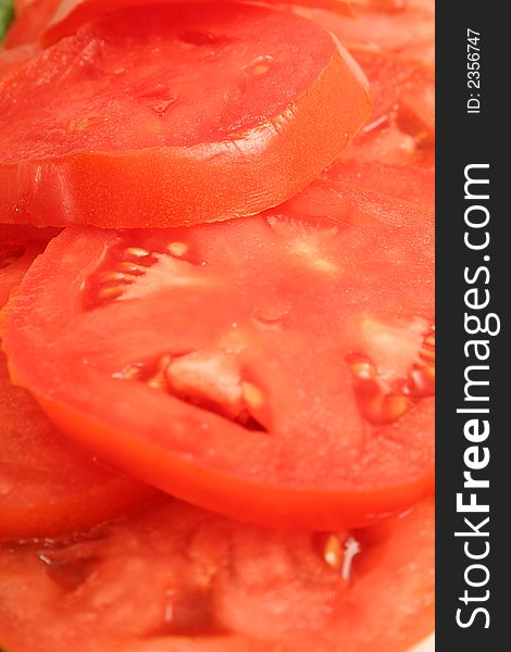 Photo of sliced tomatos vertical upclose