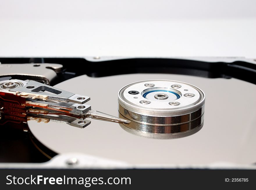 Close-up of an opened hard disk drive. Close-up of an opened hard disk drive