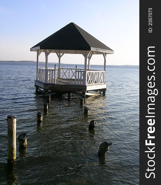 Wooden arbour building in the water - polish lake