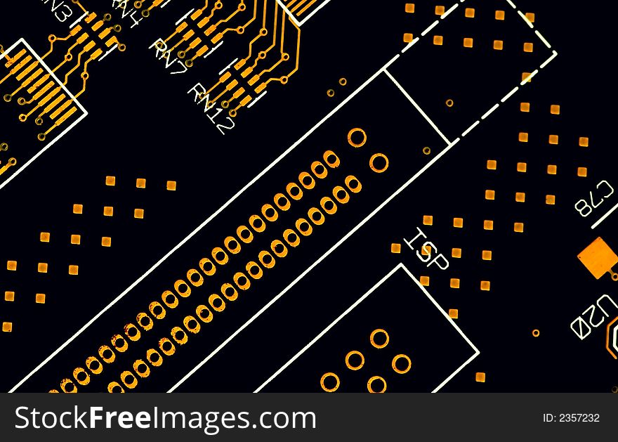 A close up of black and gold circuit plate. A close up of black and gold circuit plate