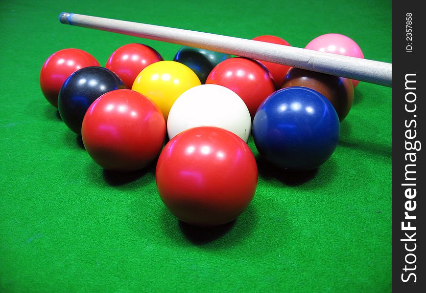 Billiards balls on a green table,billiard table and balls and cue