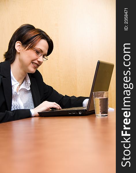 Business woman working hard on her laptop. Business woman working hard on her laptop