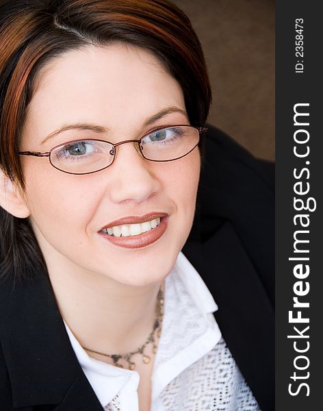 Business portrait of a cute woman looking up