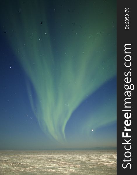 Aurora Borealis display in the sky over arctic tundra. Twilight time. Aurora Borealis display in the sky over arctic tundra. Twilight time
