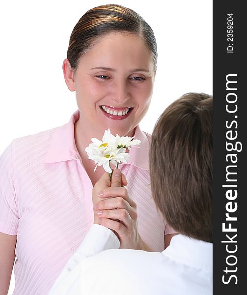 Boy giving daisies to his mom, focus on mother, isolated on white. Boy giving daisies to his mom, focus on mother, isolated on white