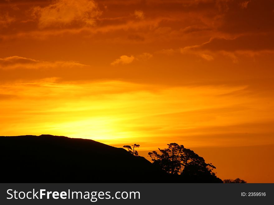 Gorgeous orange sunset over mount wellington auckland. Gorgeous orange sunset over mount wellington auckland